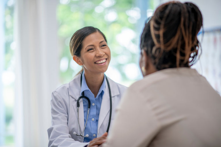 female doctor with female patient